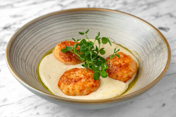 Children's meal in the restaurant. Turkey or chicken puree and cutlets in a festive plate on a marble background. Restaurant banquet menu.