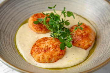 Children's meal in the restaurant. Turkey or chicken puree and cutlets in a festive plate on a marble background. Restaurant banquet menu.