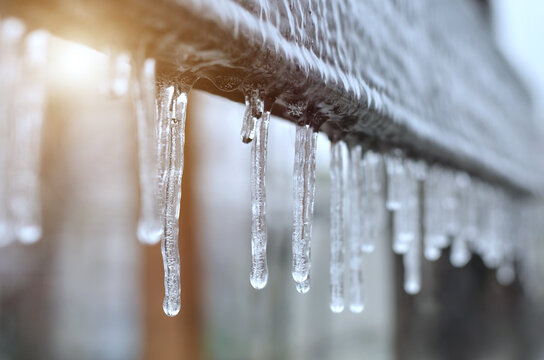 Close-up of icicles after a winter ice storm. Effect of atmospheric icing.