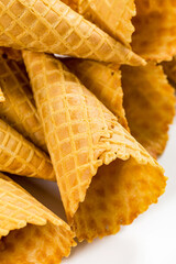 Waffle Ice Cream Cones on White Background. Cone Shaped Pastry. Selective focus.