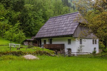 Old house in Soca river valley near Bovec village, Slovenia