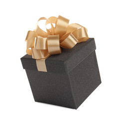 Beautiful black gift box with golden bow on white background