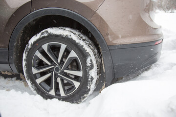 Car stuck is in a snowdrift in winter - 477914236
