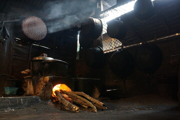Traditional kitchen is cooking with firewood. Sunshine pours through the window