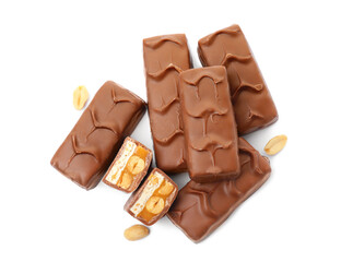 Chocolate bars with caramel, nuts and nougat isolated on white, top view
