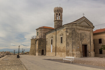 Punta lighthouse and Our Lady of Health Church in Piran town, Slovenia