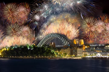Foto op Plexiglas Sydney Harbour Bridge New Years Eve fireworks, colourful NYE fire works lighting the night skies with vivid multi colours © Elias Bitar