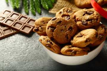 Homemade vegan chocolate chip cookies on  holiday background.