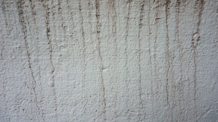 White concrete wall surface with dirty rust stains for background or illustration.