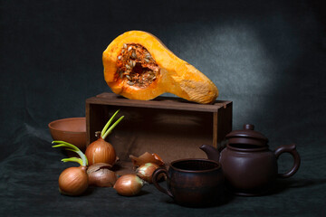 Still life with vegetables and utensils on a dark green background © i_valentin