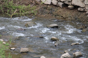 water flowing into the river