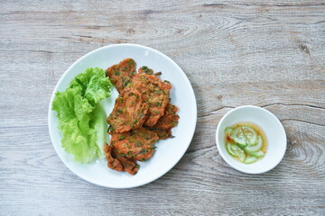 fried fish patty on plate dipping sweet chili sauce