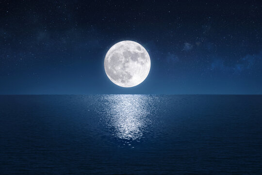 Full moon over the peaceful sea (Elements of the moon image furnished by NASA) © Paitoon