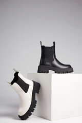 black and white boots. fashion shoes still life