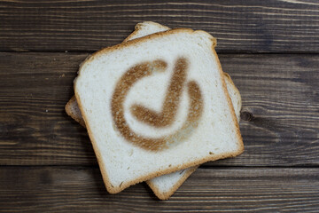 toast with a sign of done business on dark wood.