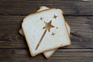 toast with the sign of the magic wand on dark wood.