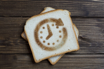 toast with the sign of the time on dark wood.