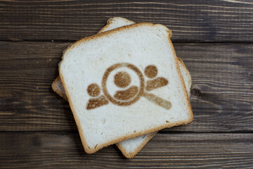 toast with people search sign on dark wood.