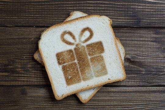 toast with a gift sign on dark wood.