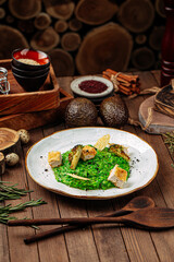 Gourmet spinach risotto with fried chicken and broccoli