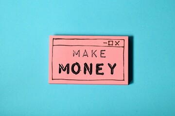 Obraz premium Make money inscription on hand drawn web browser window on blue background. Earning money online concept. 