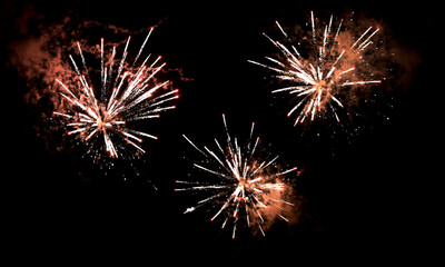 Textures of festive fireworks and bright particles on a black background - 477936075
