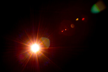 Sun flare on the black background