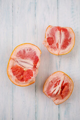 Fresh juicy grapefruit broken into pieces, top view