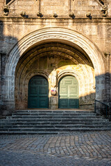 Fototapeta na wymiar Close up detail of the facade of the church of Saint Ronan in Locronan. Doorway