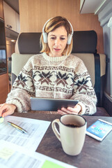 Woman telecommuting during a camper van trip