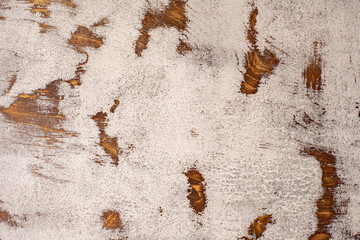 Aged mahogany countertop with cracked and frayed white paint