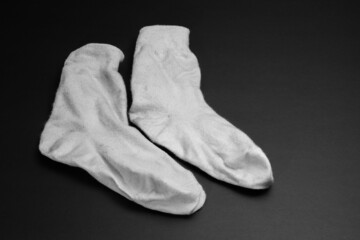 a pair of socks on a black background. background picture.