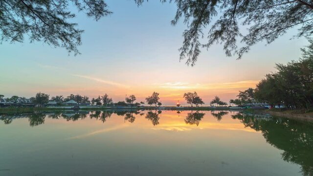 time lapse reflection of sunset in the lagoon close to Karon beach..A swamp in a park on Karon beach It is a place to relax, exercise, and host festive events