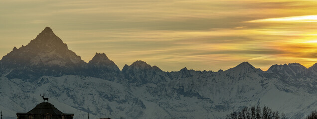 Beautiful sunset panorama of north west italian alps with Monviso and Palazzina di caccia of...