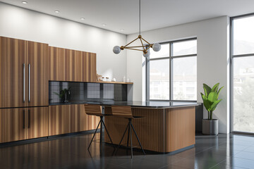 White and wooden kitchen set interior with dining table and bar chairs, window