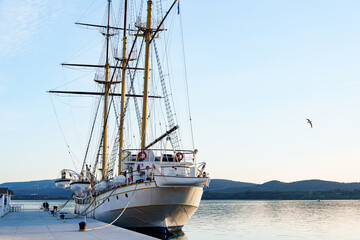 Fototapeta na wymiar White sailing yacht is moored off the coast of Tivat. Montenegro
