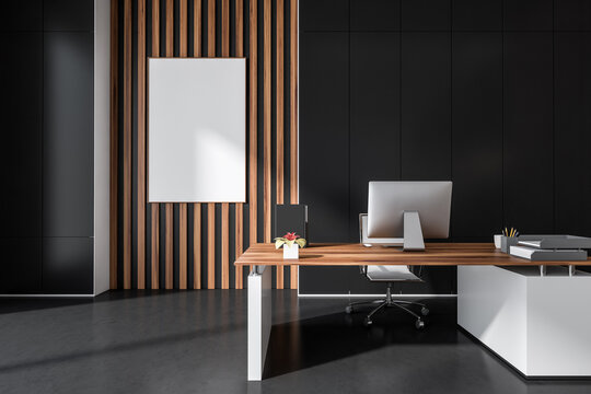 Empty frame in dark grey office with wall panels