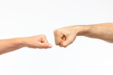 hands of a man and a woman hands reaching towards each other on a white background. Friendship and respect concept