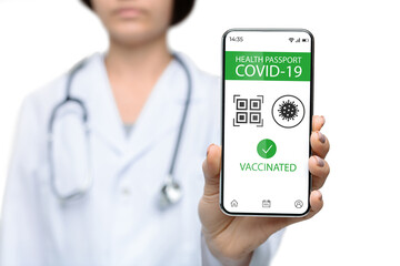 Medical worker showing smartphone with digital health passport