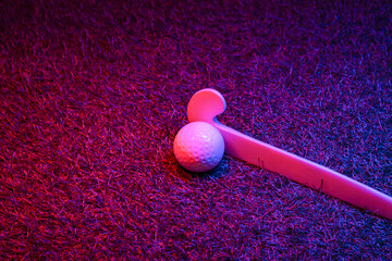 Field hockey and ball on grass with neon lighting. Blue neon banner. Horizontal sport theme poster,...