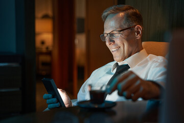Close-up photo of businessman resting at hotel