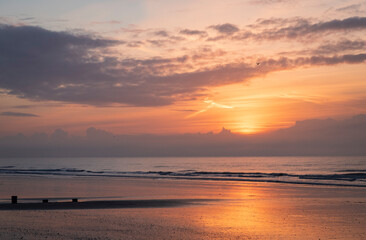 December sunrise at low tide on Bexhill beach East Sussex, south east England