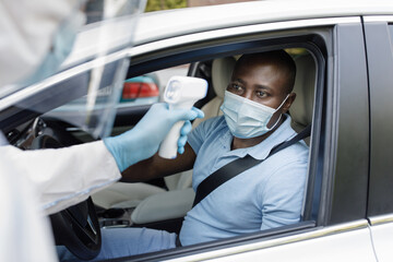 Black man driver wearing protective face mask