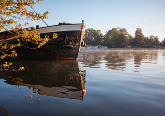 Self-propelled barge on the misty river spree in the morning.