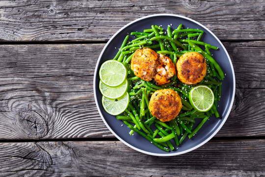 Prawn And Crab Cakes On A Plate With Green Beans