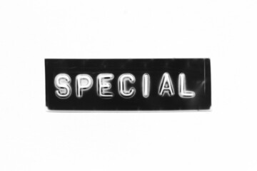 Black color banner that have embossed letter with word special on white paper background