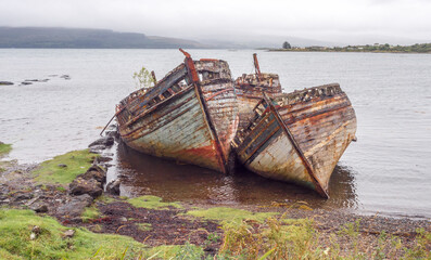 Old wrecked fishing boats at Salen beach, Isle of Mull, Scotland, uk