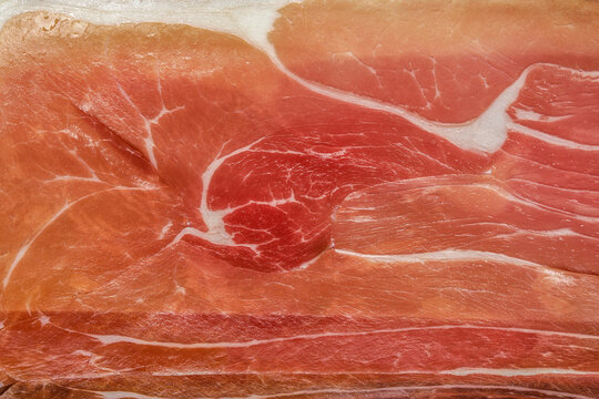 Macro photo of slices of dry-cured parma ham