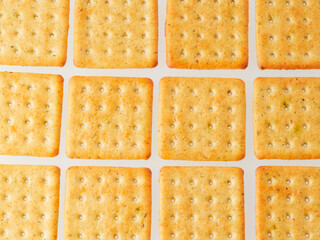 Crushed cracker and crumbs on white background