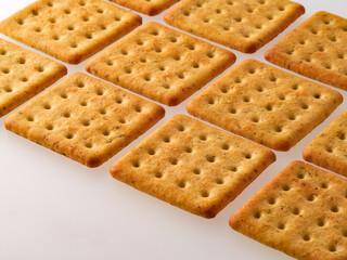 Crushed cracker and crumbs on white background